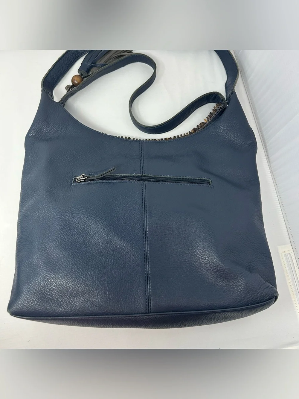 The Sak Boho Leather Hobo Bag slouchy with Beaded Trim and Tassel charm Blue
